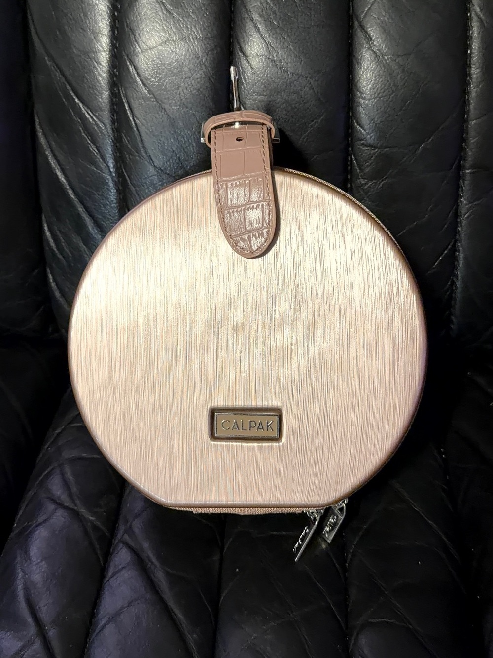 Calpak mini rose gold round hat box travel bag and cosmetic bag